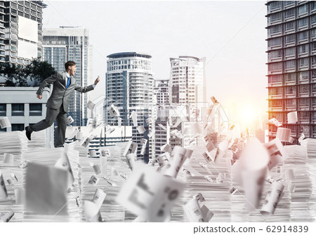 Precise businessman in suit running with phone. Precise businessman in suit running with phone. 62914839