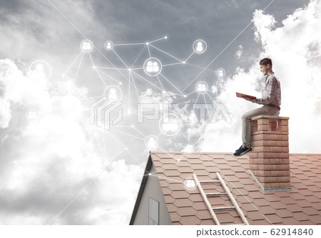 Handsome student guy reading book and concept of social connection Handsome student guy reading book and concept of social connection 62914840