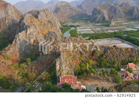 Aerial view of the limestone mountains with wetland and mangrove forest, Buddhist temple in the valley, Public attractions Khao Daeng Viewpoint, Khao Sam Roi Yot National Park, Thailand Aerial view of the limestone mountains with wetland and mangrove forest, Buddhist temple in the valley, Public attractions Khao Daeng Viewpoint, Khao Sam Roi Yot National Park, Thailand 62914925