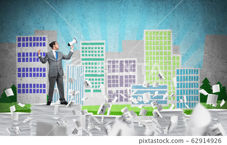 Businessman standing with megaphone. Businessman standing with megaphone. 62914926