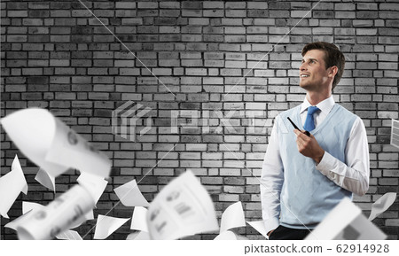 Conceptual image of young businessman. Conceptual image of young businessman. 62914928