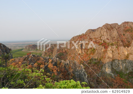 Aerial view of The limestone mountains with brown and green color leaves trees in forest at summer, Public attractions Khao Daeng Viewpoint , Khao Sam Roi Yot National Park, Thailand Aerial view of The limestone mountains with brown and green color leaves trees in forest at summer, Public attractions Khao Daeng Viewpoint , Khao Sam Roi Yot National Park, Thailand 62914929
