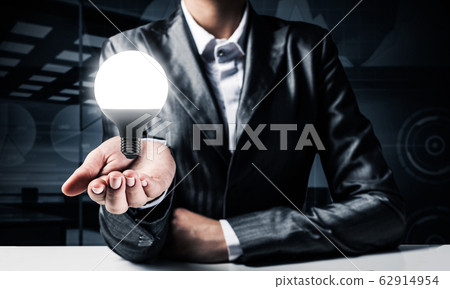 Concept of lightbulb as symbol of new idea. Concept of lightbulb as symbol of new idea. 62914954