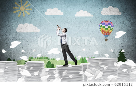 Happy businessman playing fife. 62915112