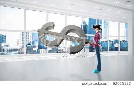Girl in virtual reality mask experiencing virtual technology world. Mixed media Girl in virtual reality mask experiencing virtual technology world. Mixed media 62915157