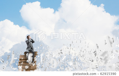Young man floating in sky and do not want to see anything 62915390