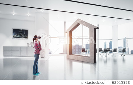 Girl in virtual reality mask experiencing virtual technology wor Girl in virtual reality mask experiencing virtual technology wor 62915538