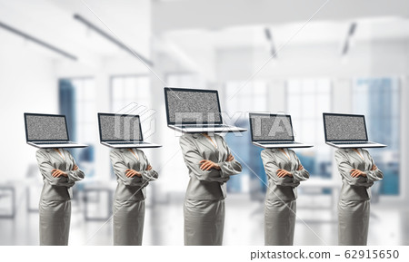 Business women with laptops instead of head. Business women with laptops instead of head. 62915650