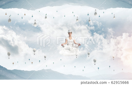 Young woman keeping mind conscious. Young woman keeping mind conscious. 62915666