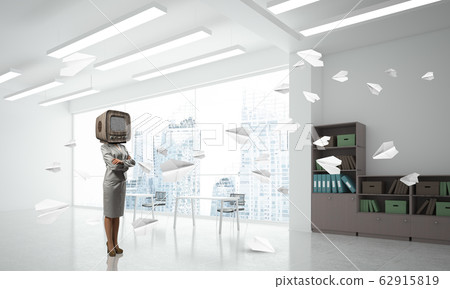 Business woman with an old TV instead of head. Business woman with an old TV instead of head. 62915819