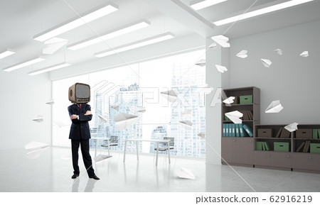Businessman with an old TV instead of head. Businessman with an old TV instead of head. 62916219