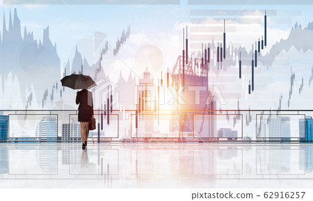 Elegant businesswoman standing with back and looking at modern business cityscape. Mixed media Elegant businesswoman standing with back and looking at modern business cityscape. Mixed media 62916257