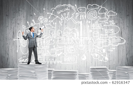Businessman standing with megaphone. Businessman standing with megaphone. 62916347