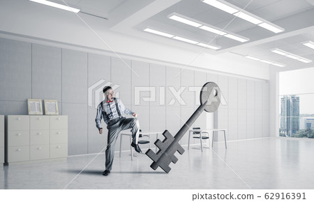 Breaking through access concept with furious man crashing concre Breaking through access concept with furious man crashing concre 62916391