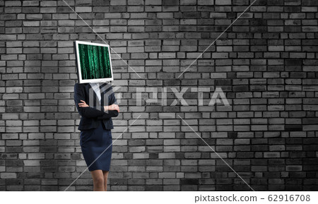 Business woman with monitor instead of head. Business woman with monitor instead of head. 62916708