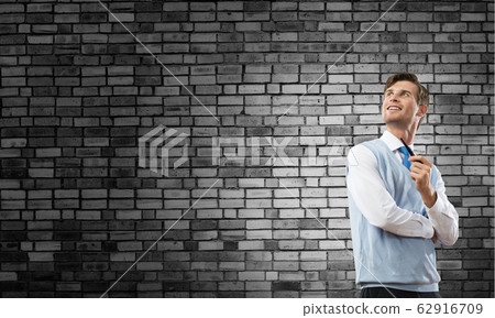 Conceptual image of young businessman. Conceptual image of young businessman. 62916709