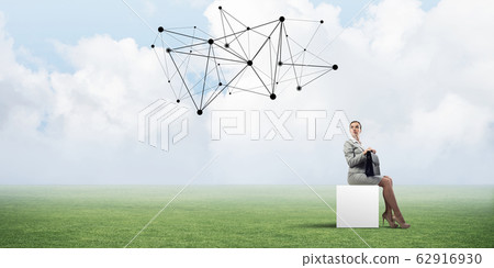 Attractive business lady or accountant outdoors on white box 62916930