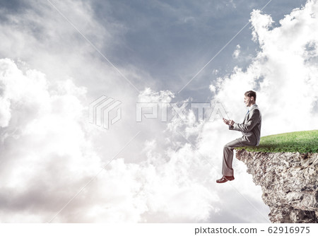 Businessman in suit with smartphone in hands send message Businessman in suit with smartphone in hands send message 62916975