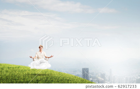 Young man keeping mind conscious. Young man keeping mind conscious. 62917233