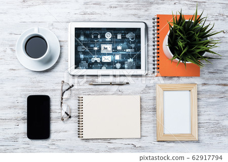Business still life concept with office stuff on wooden table Business still life concept with office stuff on wooden table 62917794