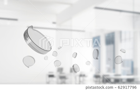 Concept of communication by glass empty chat icon on office background. Mixed media 62917796