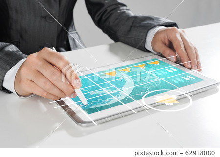 Media technologies for business as concept with woman working on tablet Media technologies for business as concept with woman working on tablet 62918080