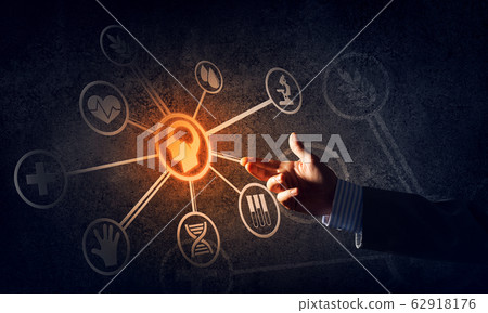 Close of businessman hand showing at user interface glowing on wall 62918176