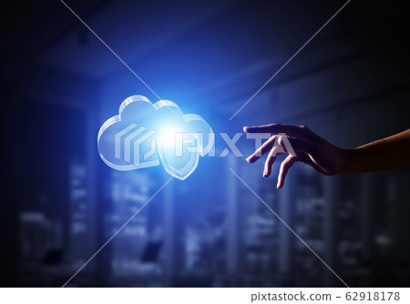 Cloud computing concept with glass symbol shown in hand. Mixed media 62918178