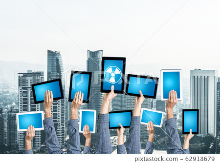 Close of man hands in line showing tablet pc with blank blue scr 62918679