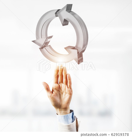 Web refresh icon and male hands as symbol for internet use. Mixe 62919378