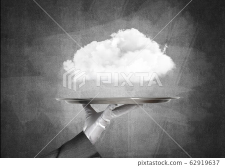 Hand of waitress presenting cloud on tray. 62919637