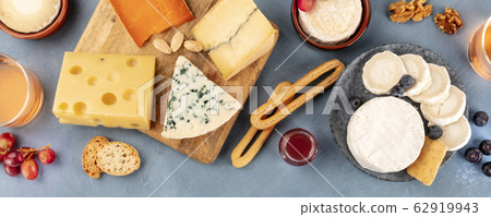 Cheese panoramic flat lay. Blue cheese, Brie, Emmental, goat cheese, and others, shot from the top Cheese panoramic flat lay. Blue cheese, Brie, Emmental, goat cheese, and others, shot from the top 62919943