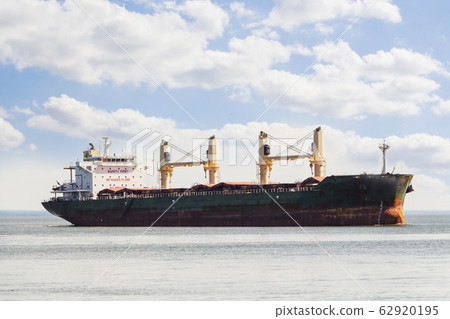 Aerial view of general cargo ship in open sea. 62920195
