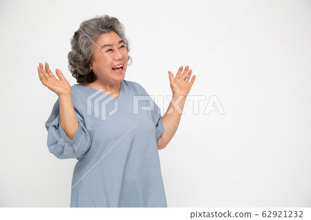 Portrait of excited screaming asian senior woman 62921232