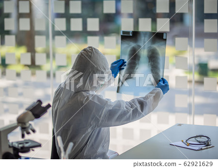 Close up of male doctor holding x-ray. Close up of male doctor holding x-ray. 62921629