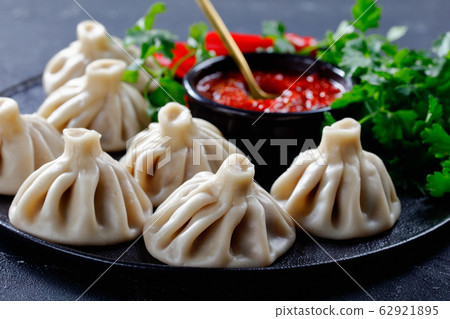 close-up of Khinkali, dumplings with meat filling close-up of Khinkali, dumplings with meat filling 62921895