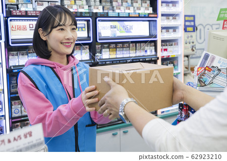 Portrait of young woman and man, part timer and owner 585 62923210