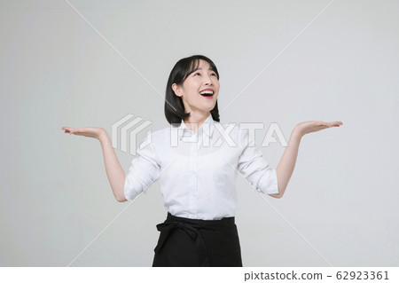 Portrait of young woman and man, part timer and owner 306 62923361