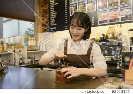 Portrait of young woman and man, part timer and owner 403 Portrait of young woman and man, part timer and owner 403 62923565