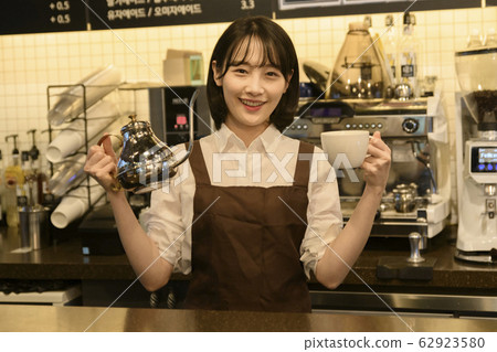 Portrait of young woman and man, part timer and owner 400 Portrait of young woman and man, part timer and owner 400 62923580