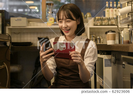 Portrait of young woman and man, part timer and owner 461 62923606