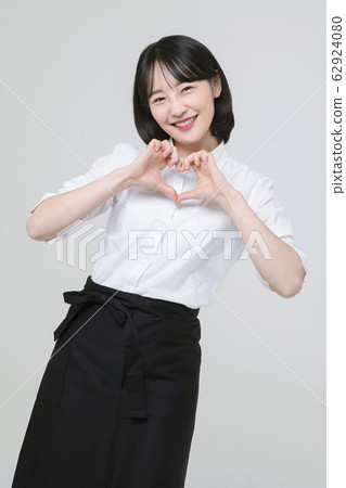 Portrait of young woman and man, part timer and owner 302 62924080