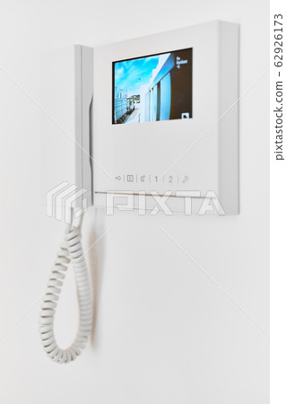 On white wall video intercom with street view 62926173