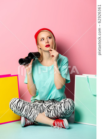 Style woman with shopping bags and binoculars Style woman with shopping bags and binoculars 62926361