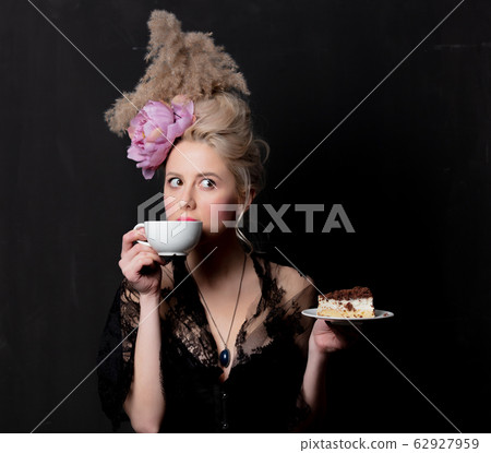 Beautiful blonde countess with cake and cup Beautiful blonde countess with cake and cup 62927959