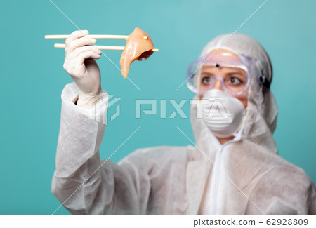 medic woman wearing protective clothing against 62928809