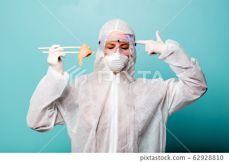 medic woman wearing protective clothing against 62928810