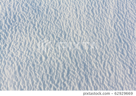 Convex snow background on the frozen surface Convex snow background on the frozen surface 62929669