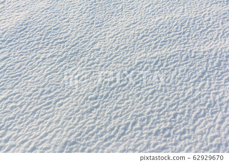 Convex snow background on the frozen surface Convex snow background on the frozen surface 62929670