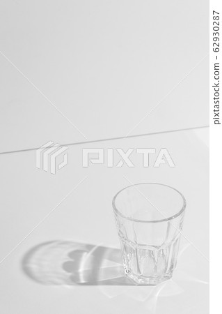 Monochrome photo of glass with hard shadows. Monochrome photo of glass with hard shadows. 62930287